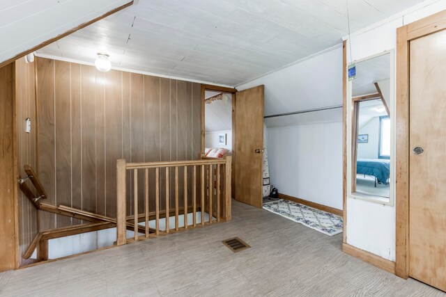 interior space featuring wood walls