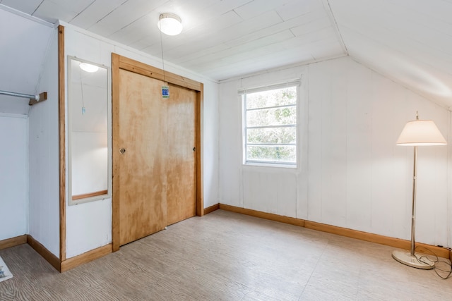 interior space with wooden ceiling and vaulted ceiling