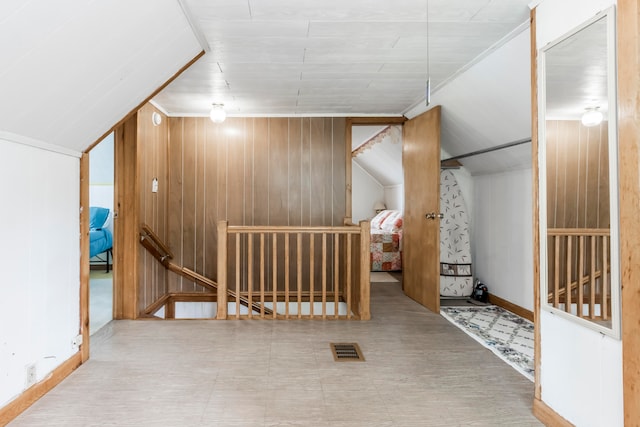 bonus room with wooden walls