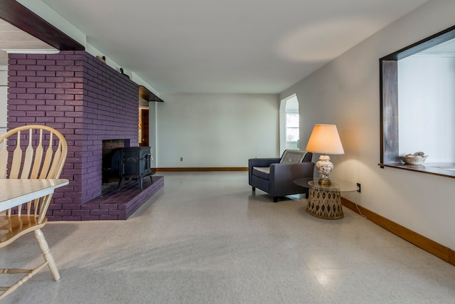 living room featuring a wood stove