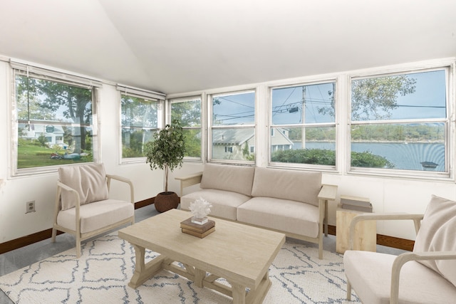 sunroom / solarium with a water view and a wealth of natural light