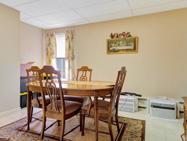 dining area featuring a paneled ceiling