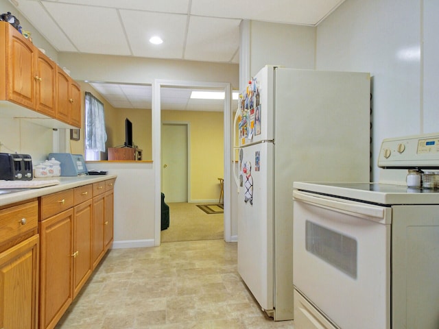 kitchen with light carpet, white electric range, and a drop ceiling