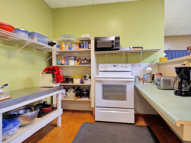 kitchen with light hardwood / wood-style flooring, white electric range oven, and a drop ceiling