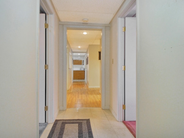 hallway with light hardwood / wood-style flooring