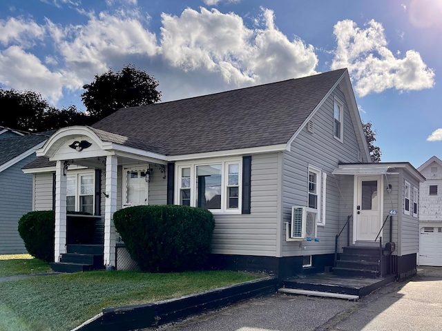 view of front of house featuring a garage and a front lawn