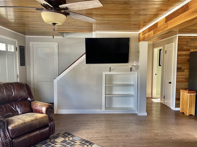 unfurnished living room with ceiling fan, ornamental molding, hardwood / wood-style floors, and wooden ceiling