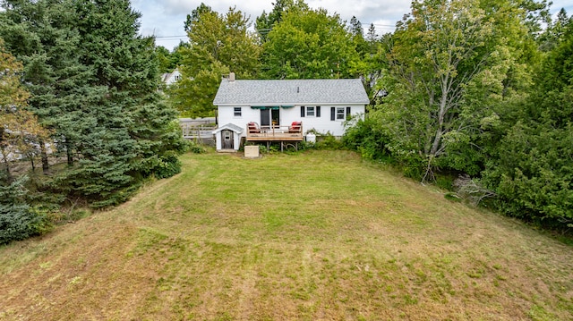 exterior space with a front yard and a deck