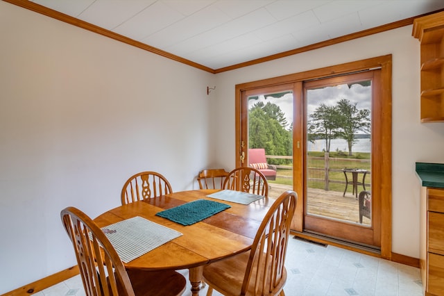 dining room featuring ornamental molding