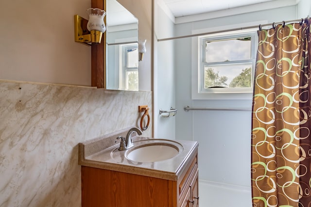 bathroom with vanity and a shower with curtain