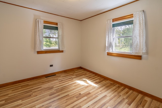 empty room with light hardwood / wood-style floors