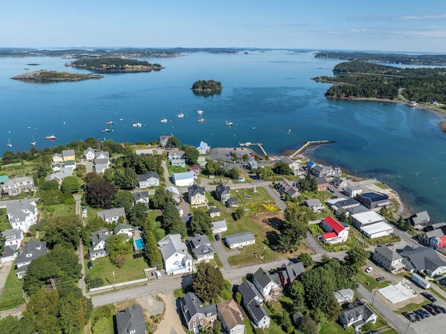 birds eye view of property with a water view and a residential view