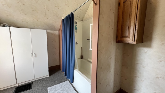 bathroom with visible vents and shower / bath combo