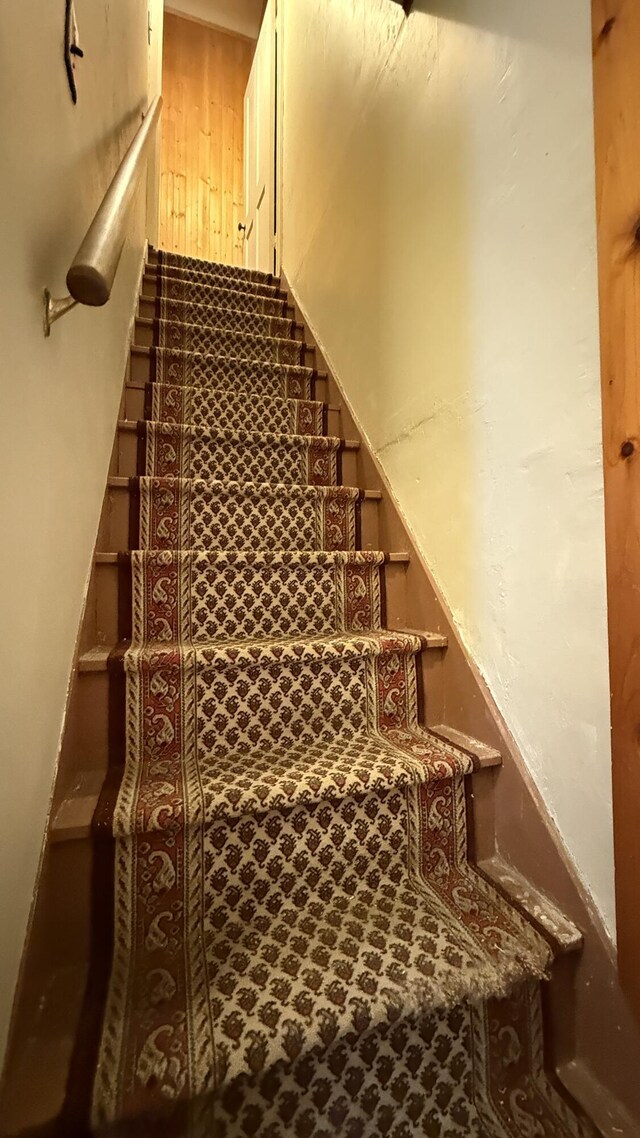 stairway with wooden walls