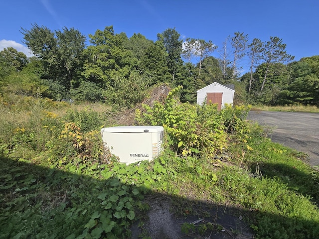 details featuring a power unit and a view of trees