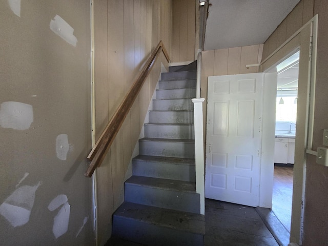 stairway with wooden walls