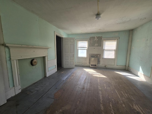 unfurnished living room with hardwood / wood-style flooring