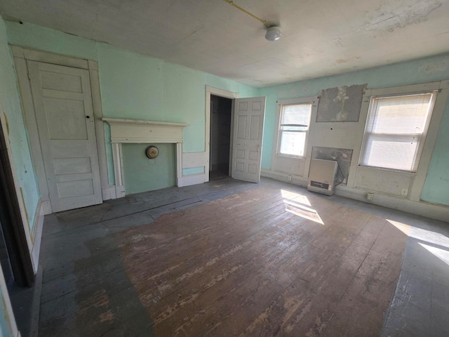 unfurnished living room with dark wood-type flooring