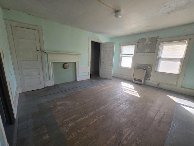 unfurnished living room featuring hardwood / wood-style floors