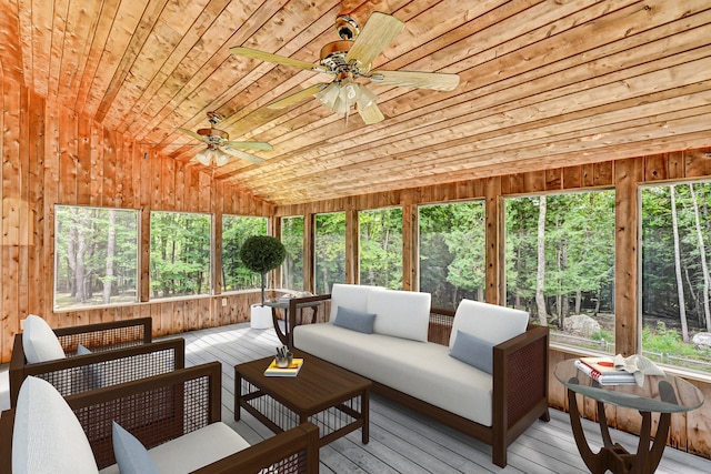 sunroom with wood ceiling and ceiling fan