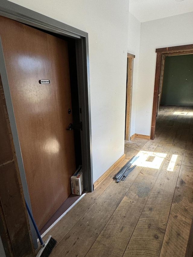 hall with light hardwood / wood-style flooring