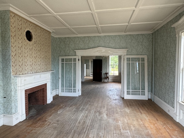 unfurnished living room featuring wood-type flooring, a brick fireplace, and coffered ceiling