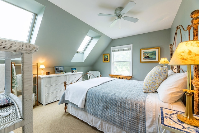 bedroom featuring carpet, ceiling fan, and lofted ceiling with skylight