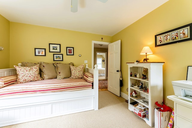 bedroom featuring ceiling fan and light colored carpet