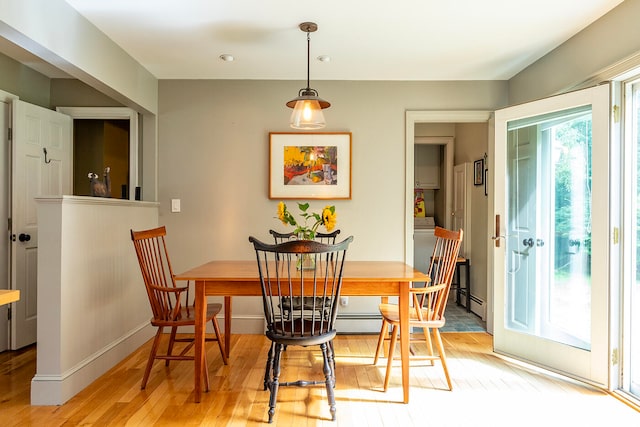 dining space with light wood-type flooring