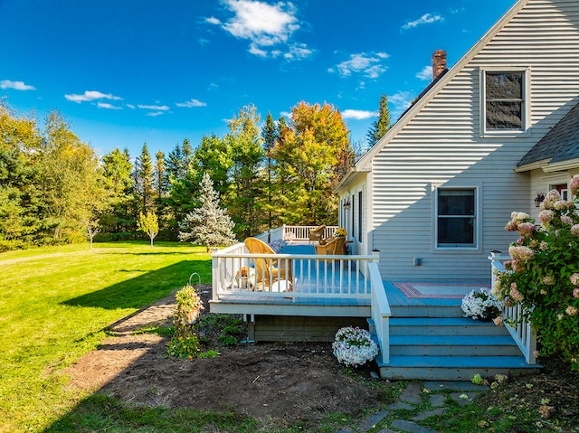 wooden deck with a lawn