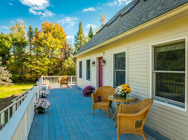 wooden terrace featuring visible vents