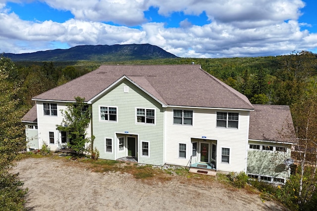 back of house featuring a mountain view