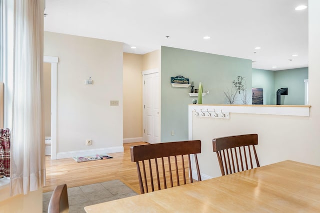 dining area with light hardwood / wood-style floors