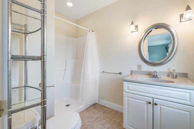 bathroom featuring a shower with shower curtain, tile patterned flooring, toilet, and vanity