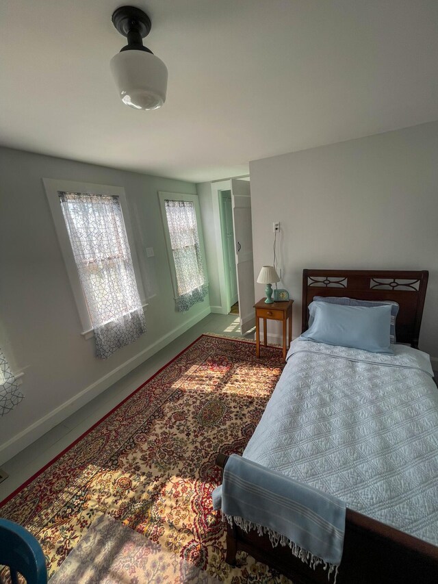 bedroom featuring baseboards