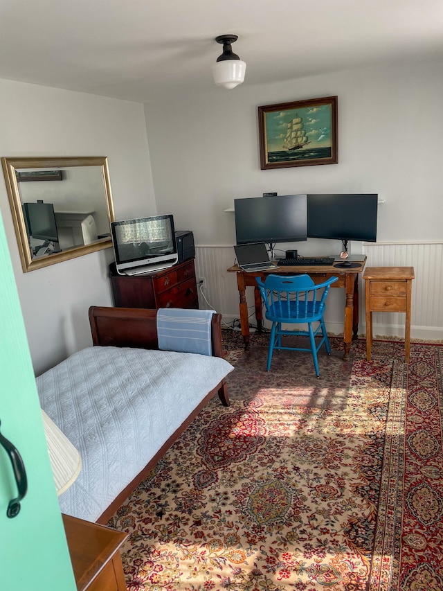 bedroom featuring wood walls