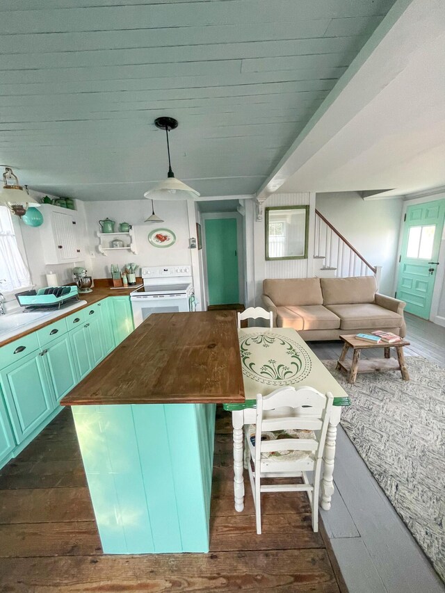 kitchen featuring wooden counters, decorative light fixtures, a center island, dark hardwood / wood-style flooring, and white range with electric stovetop