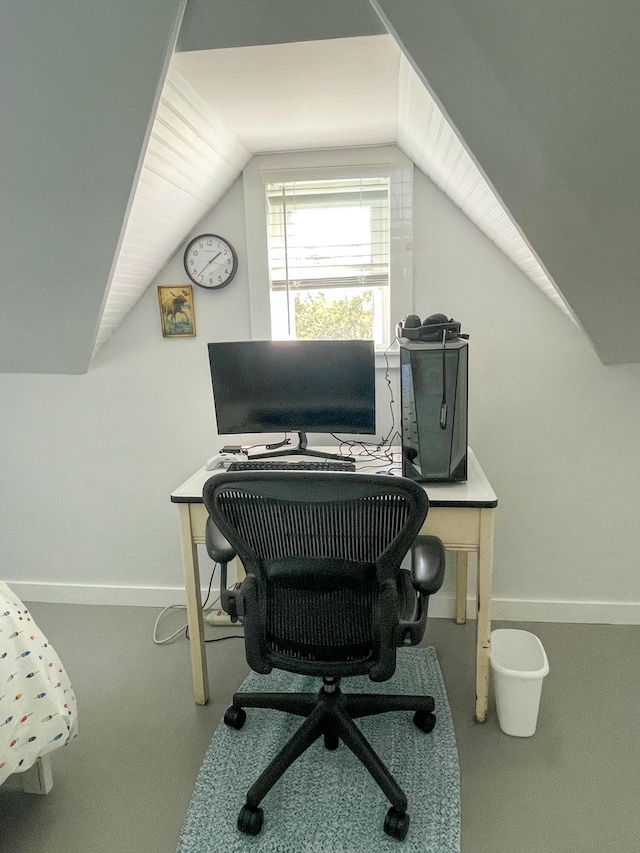 home office featuring vaulted ceiling and carpet floors