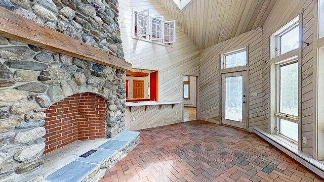 mudroom featuring baseboard heating, high vaulted ceiling, and wood ceiling