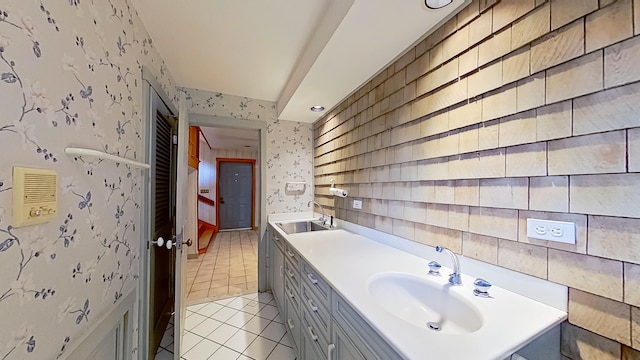 bathroom with tile patterned flooring and vanity