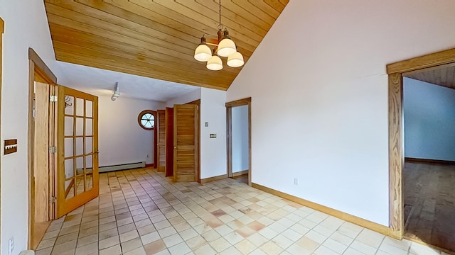 tiled spare room featuring lofted ceiling, a baseboard heating unit, wood ceiling, and a notable chandelier