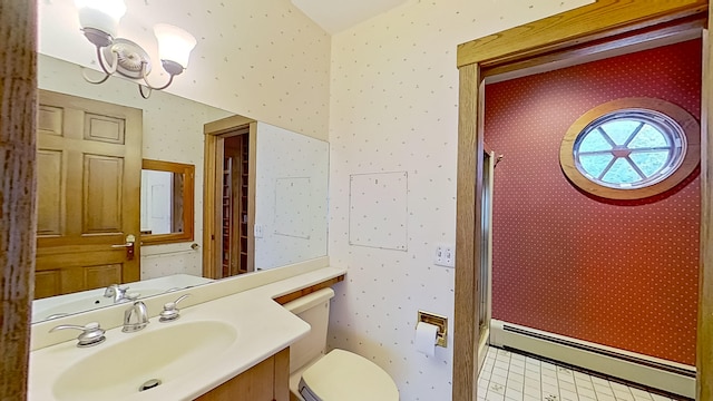 bathroom featuring a baseboard radiator, toilet, a shower with door, and vanity