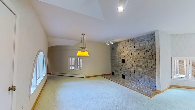 unfurnished living room featuring lofted ceiling, a baseboard radiator, and light colored carpet