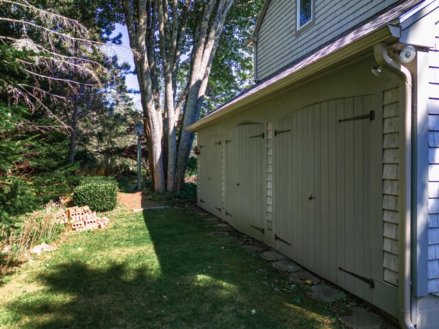 view of property exterior with a yard