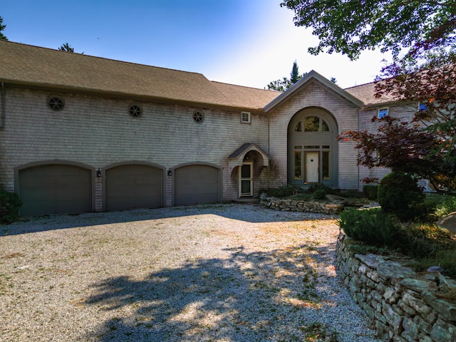 view of front of property with a garage