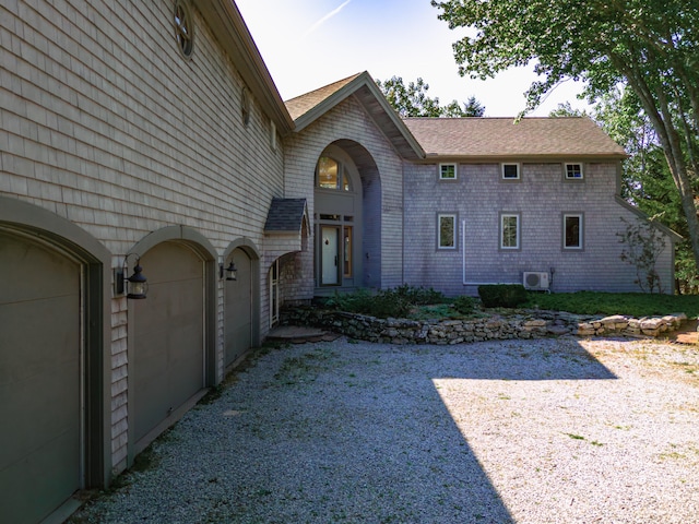 view of side of property featuring a garage