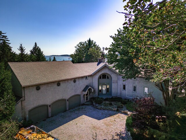 view of front facade with a garage and french doors