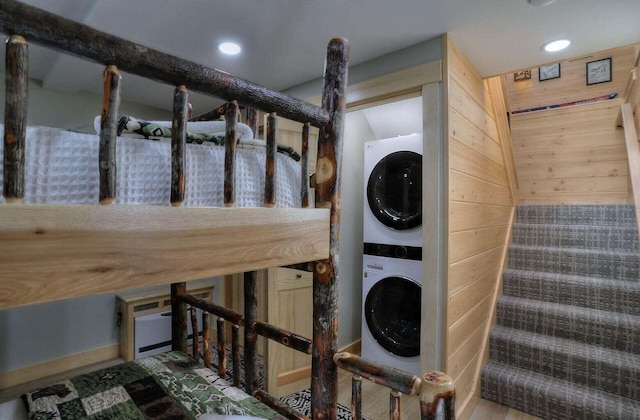 laundry room with stacked washer and dryer