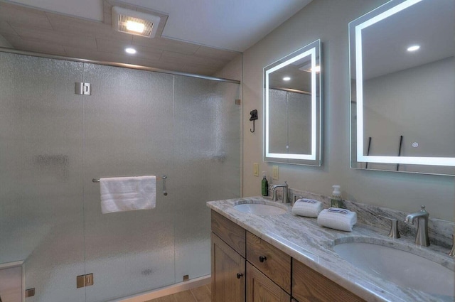 bathroom with vanity and walk in shower