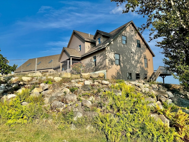 view of side of home with a deck